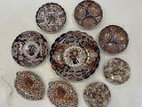 many different types of shells on a white surface