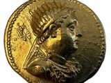 l'image d'une pièce d'or surmontée d'une couronne