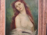 tableau représentant une femme aux longs cheveux roux, dans un cadre doré