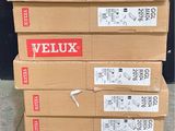 several boxes of veluxx are stacked on top of each other
