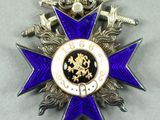 purple and gold medal with a blue star on a white background