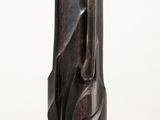 sculpture of a woman ' s face on a white pedestal
