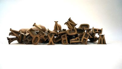 a pile of wooden letters sitting on top of each other