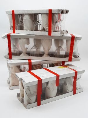 a stack of three boxes that have different types of items in them