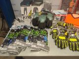 several pairs of gloves, gloves, gloves, and other items on a table