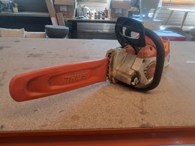 a chainsaw sitting on the counter in the kitchen