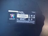 the back of a laptop computer with a sticker on it ' s side