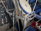 a pile of blue and white chairs in a room