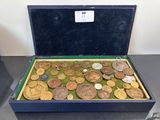 a box full of coins sitting on a table
