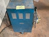 a blue machine that is sitting in a room