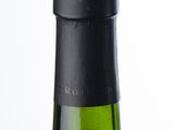 a bottle of wine that is sitting on a table