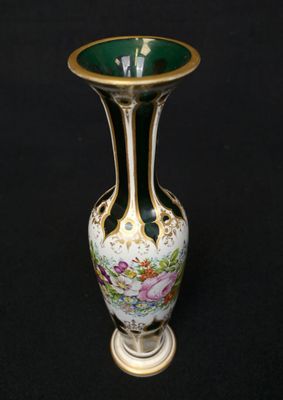 a vase that is sitting on a black surface