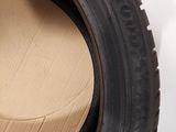 a close up of a tire with a cardboard box inside of it