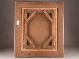 an old wooden picture frame with a square design in the middle