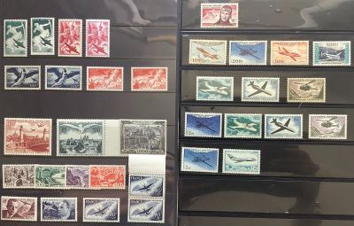a lot of stamps on display on the wall