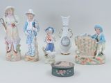 five figurines that are sitting on a table