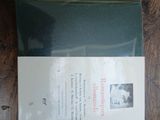 a picture of a piece of paper on a wooden floor