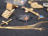 a lot of gold and silver jewelry on a table