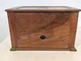 an old wooden box sitting on top of a white table