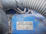 a close up of a blue machine with a hose attached to it