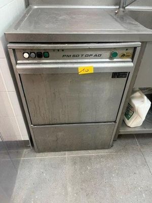 a dishwasher that is sitting in the corner of a kitchen