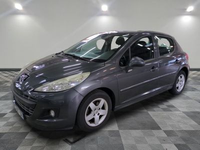a picture of a grey car parked in a garage