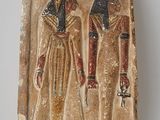 an ancient egyptian relief of two men with hats and scarves