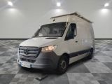 a white van that is parked on a checkered floor