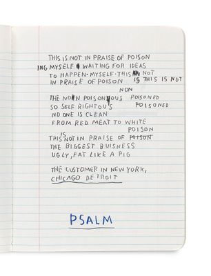 notebook with a notepad and pen on top of it with a poem written on it