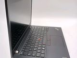 a laptop that is open on a white surface