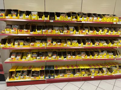 many shelves with different types of chocolates on them