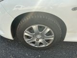 a close up of a car ' s tire on the road