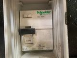 a white box that has some electrical wires inside of it