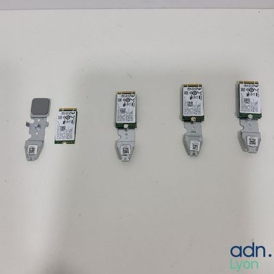 four different types of electronic devices are displayed on a white surface