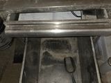 a silver oven with a spoon and a spoon in it