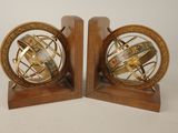 pair of antique brass globe bookends on wooden bases