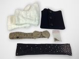 several pieces of clothing are laid out on a white surface