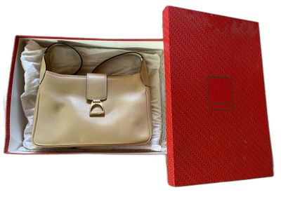 red box with a white purse inside of it on a white surface