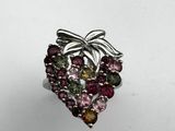 a close up of a ring with a bunch of different colored stones