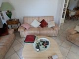 a living room with couches and a table in it