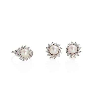 a pair of pearl and diamond earrings