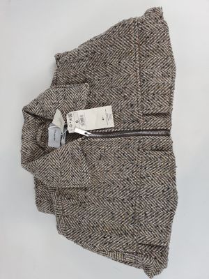 pantalon en tweed gris à motif « herringle » avec des fermetures éclair et une étiquette sur le côté
