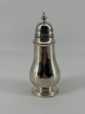 silver plated salt and pepper shaker on a stand