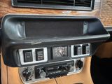 a car dashboard with a clock and a radio in it