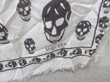 a black and white scarf with skulls on it