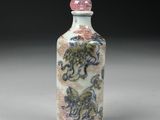 chinese porcelain snuff bottle decorated with a dragon and flowers