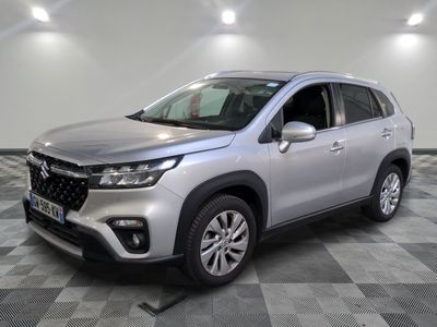 a silver suv parked on a checkered floor in a garage