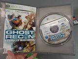 someone is holding a video game in a clear case