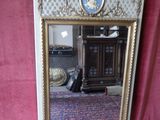 a mirror that has a picture of a man on it