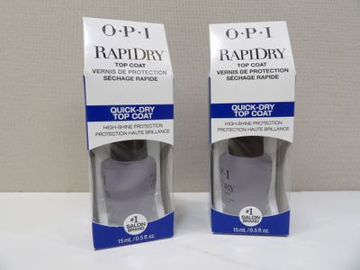 two bottles of opi rapiddry on display in a box